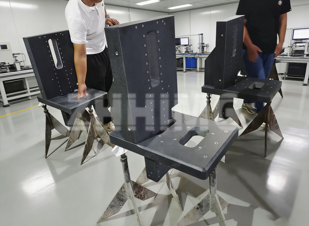 Machined black granite components with threaded inserts at the ZHHIMG factory