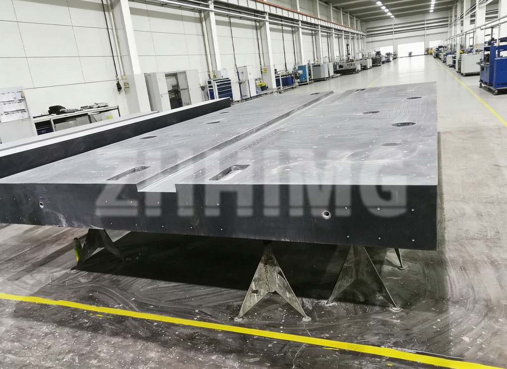Large ZHHIMG granite surface plate with inserts supported on stands during machining and lapping